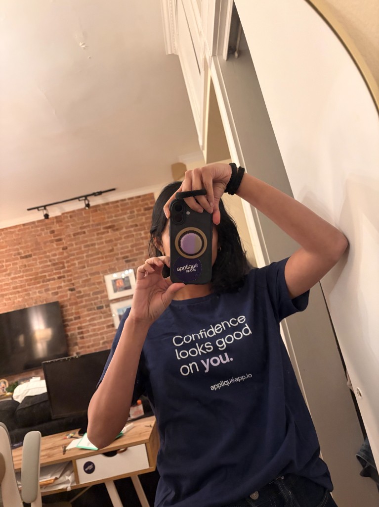 Mirror selfie in home workspace