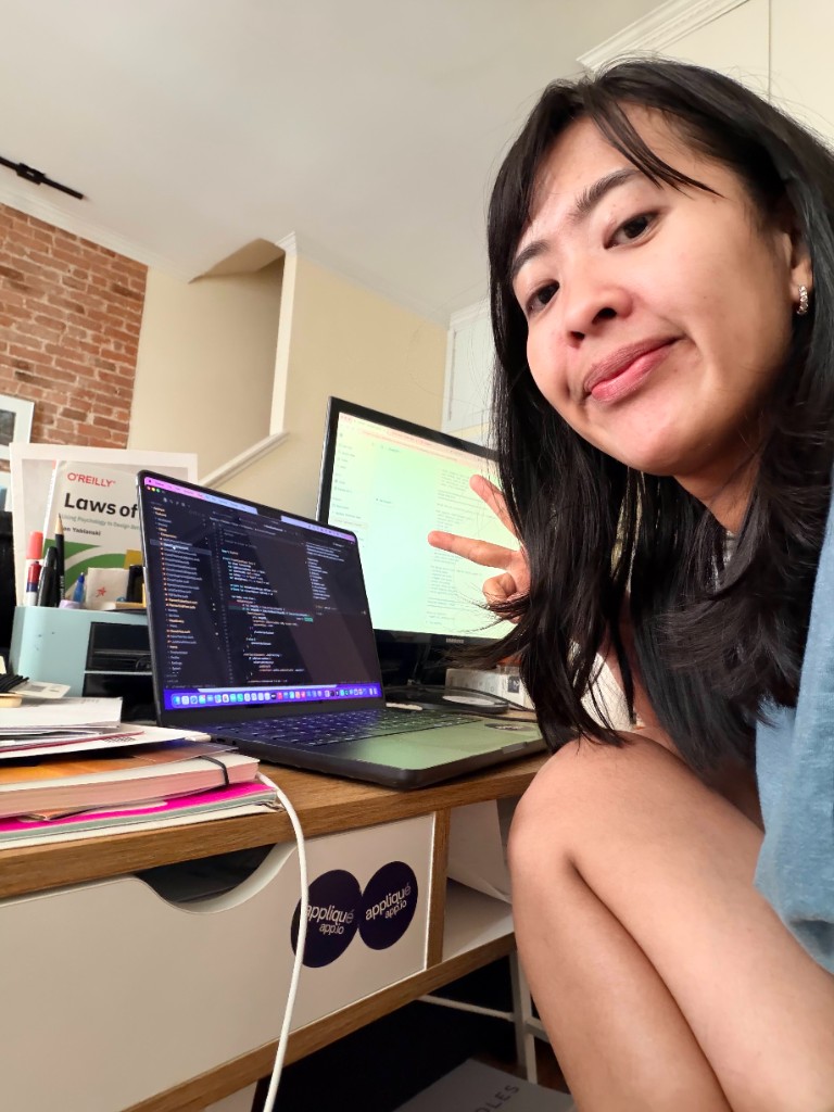 Working at desk with laptop and monitor